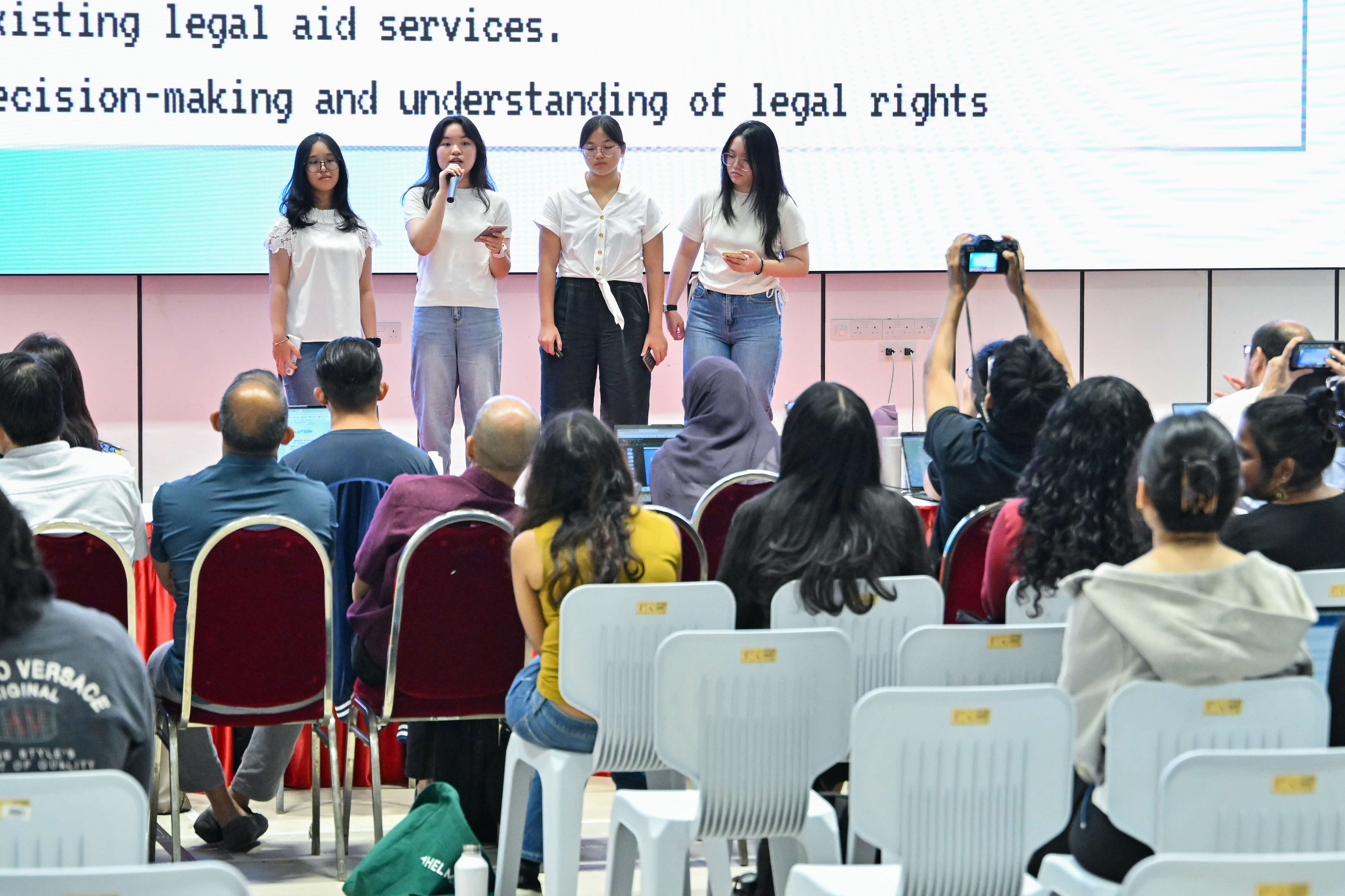 Four students presenting to the panel